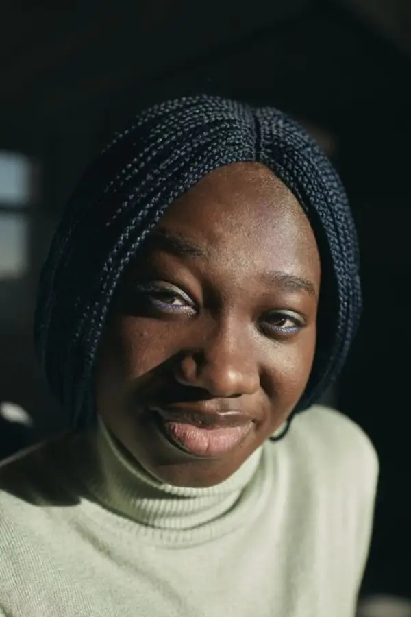 Smiling portrait of Amara, a Coffer user in London.