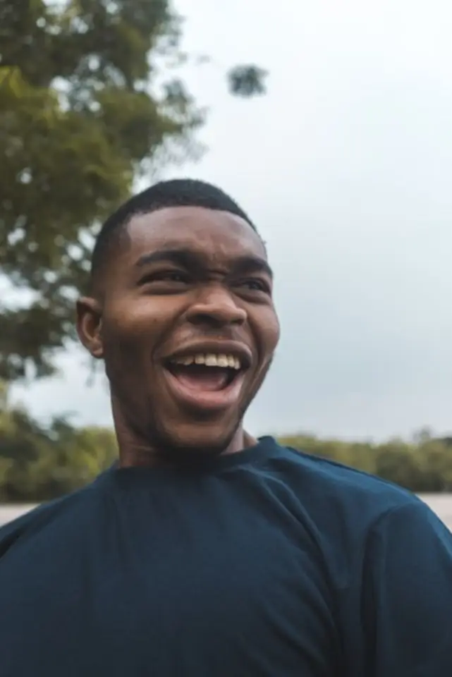 Laughing portrait of Tunde, a Coffer user in Abuja.
